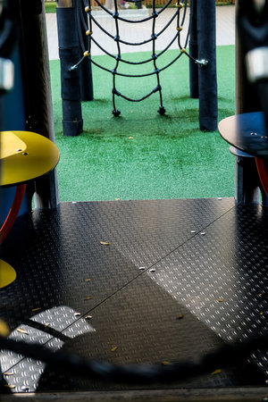Empty playground in the park during the day.の写真素材