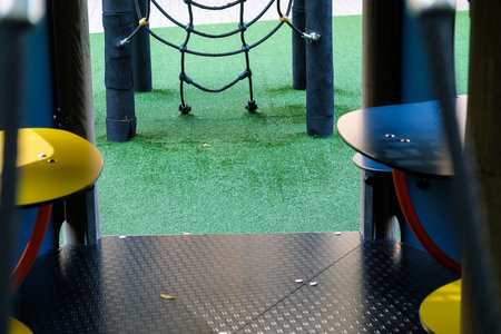 Empty playground in the park during the day.の写真素材