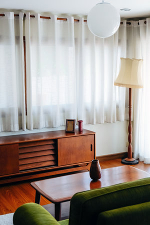 Interior of a living room with green sofa and coffee table.の写真素材