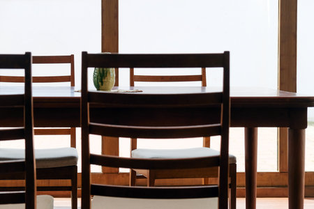 Wooden table and chairs in a room, stock photo image.の写真素材