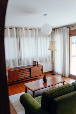Interior of a living room with green sofa and coffee table.の写真素材