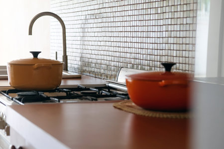 Cooking pot on the kitchen table in a modern style. Selective focus.の写真素材