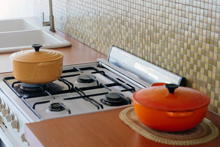 Cooking pot on the kitchen table in a modern style. Selective focus.の写真素材