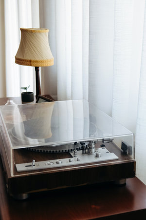 Vintage vinyl record player on table in living room at home.の写真素材