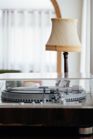 Vintage vinyl record player on table in living room at home.の写真素材