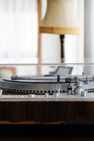 Vintage vinyl record player on table in living room at home.の写真素材