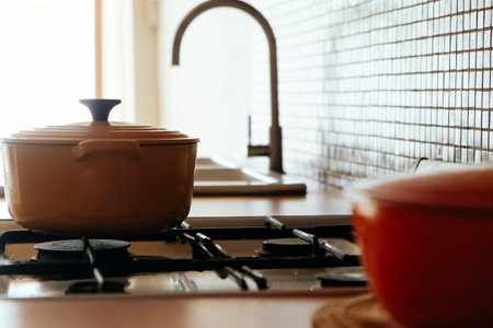 Cooking pot on the kitchen table in a modern style. Selective focus.の写真素材
