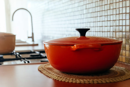 Cooking pot on the kitchen table in a modern style. Selective focus.の写真素材