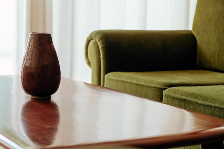 Interior of a living room with green sofa and coffee table.の写真素材