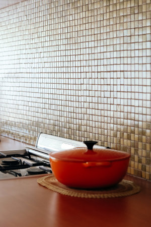 Cooking pot on the kitchen table in a modern style. Selective focus.の写真素材