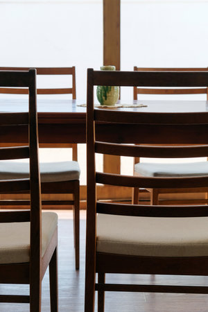 Wooden table and chairs in a dining roomの写真素材