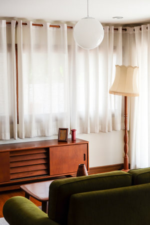 Interior of a modern living room with a green sofa and a coffee tableの写真素材