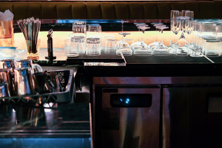 Coffee shop interior with barista equipment and glassware.の写真素材