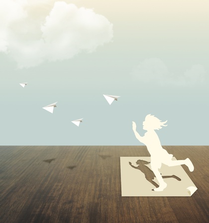 Paper cut of child on wood table with skyの写真素材