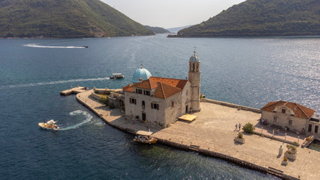 Aerial view of the church of Our Lady of the Rocks on an island in the Bay of Kotor, Montenegro. Tourist attraction in summer, sanctuary and museumの写真素材