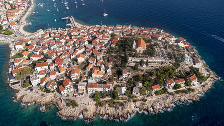 The tourist town of Primosten in Croatia with the Church of St. George in the center. Aerial view of...
