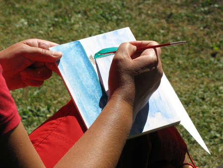Painting with watercolour in the sun.の写真素材