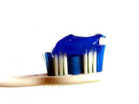 Toothbrush with toothpaste with a mix of mouth wash.の写真素材