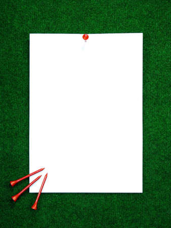 Golf note with white message area and pegs lying around.の写真素材