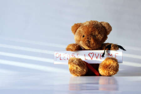 Emo love with teddybear with mourning bandの写真素材