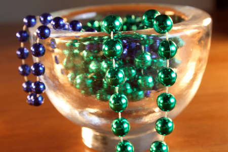 Necklace with green and blue pearls in a bowlの写真素材