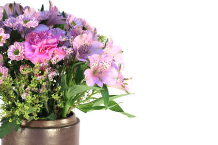 Mixed pink flowers in a vase, isolatedの写真素材