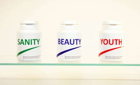 Sanity, Beauty and Youth pills in a bottle on bathroom shelf, fake brands