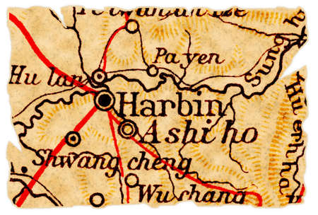 Harbin, one of the biggest cities in China on an old torn map from 1949, isolated. Part of the old map series.の写真素材