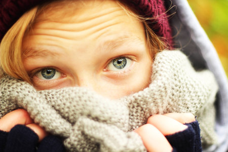 Teenage girl with scarf in the fallの写真素材