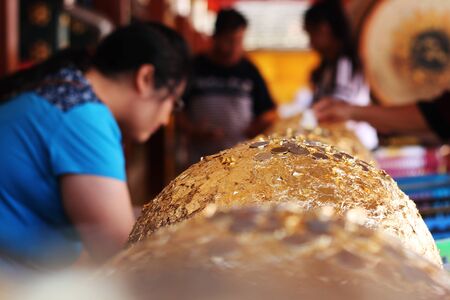 Golden Ball for Good luck in temple Thailand background.