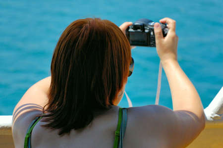 young amateur photographer with hers photocamera