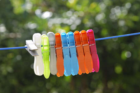 Multicolored clothes pin on rope