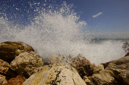 Splash of breaking waves & shipの写真素材