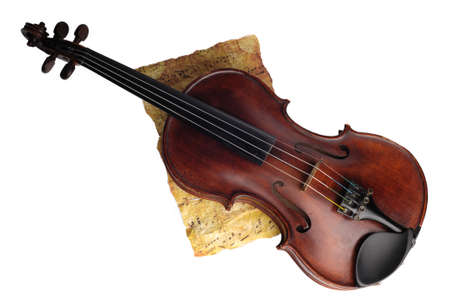 Antique  violin and notes on white backgroundの写真素材