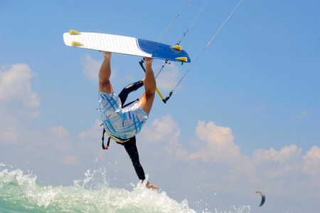 Kiteboarding in the sunny summer day on  a Mediterranean sea coastの写真素材
