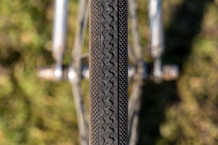Close up Symmetry Bicycle Tire on Green Grass background