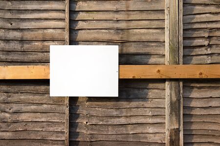 White Blank Sign on Wood Wall backgroundの写真素材