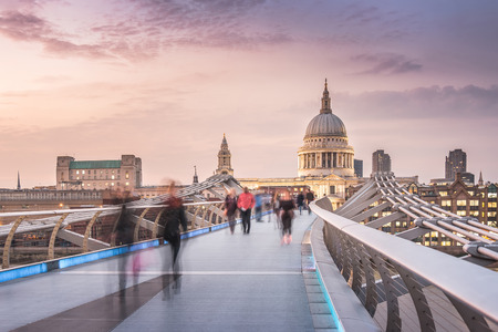The Millennium Bridge to the St Paul's Cathedral in Twilight with Moving Peopleの写真素材