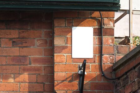 Small Null White Vertical Banner on Brick Wallの写真素材