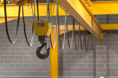 Yellow Indoor Crane's Hook and Black Slingの写真素材