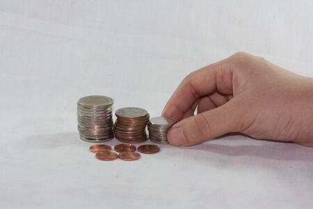 stack of several coins on white background
