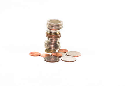 stack of several coins on white backgroundの写真素材