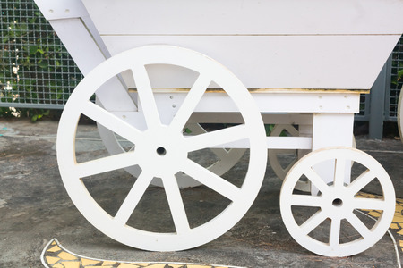 white wooden cart with wheelの写真素材