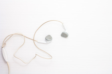 white headphone cable on white backgroundの写真素材
