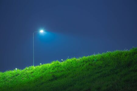 The electricity post in the night time.の写真素材