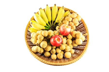 Assortment of exotic fruits and berries in baskets isolated on white backgroundの写真素材