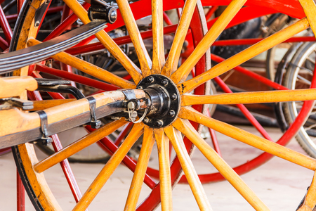 Old tools and wheels in a barnの写真素材