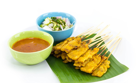 Pork Satay with Peanut Sauce on white の写真素材