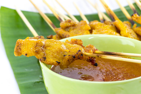 Pork Satay with Peanut Sauce on whiteの写真素材