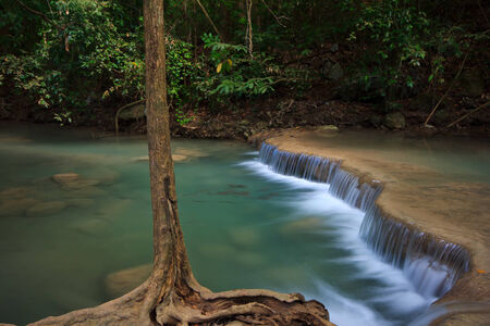 Soft water at waterfall, tree, greenの写真素材